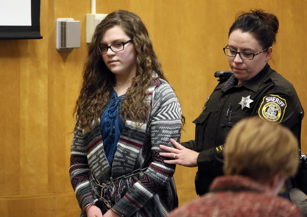 FILE - In this Dec. 21, 2017, file photo, Anissa Weier, one of two Wisconsin girls who tried to kill a classmate to win favor with a fictional horror character named Slender Man, is led into Court for her sentencing hearing, in Waukesha, Wis. A judge's decision to release Weier from a mental health facility has left the victim's family nervous and afraid, a spokesman said Tuesday, Sept. 14, 2021. (Michael Sears/Milwaukee Journal-Sentinel via AP, File)