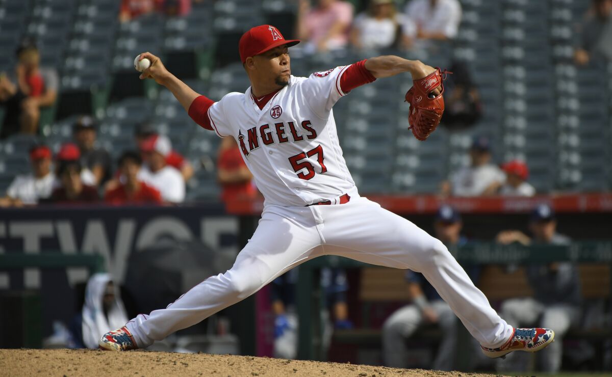 Angels pitcher Hansel Robles delivers during a 6-4 victory over the Tampa Bay Rays on Sunday.