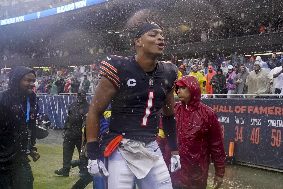 Chicago Bears' Justin Fields celebrates after an NFL football game against the San Francisco 49ers Sunday, Sept. 11, 2022, in Chicago. The Bears won 19-10. (AP Photo/Nam Y. Huh)