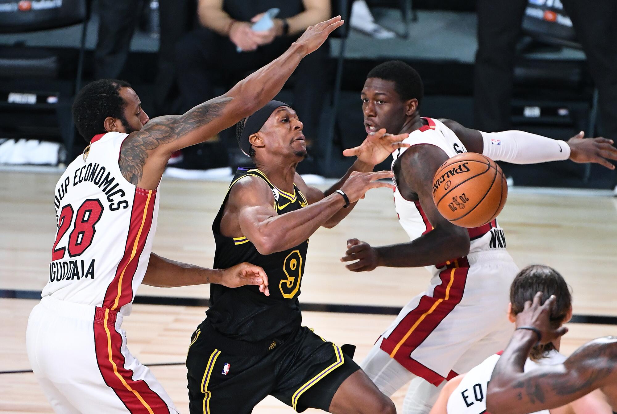 Miami's Kendrick Nunn, left, knocks the ball away from Lakers guard Rajon Rondo during Game 2 of the NBA Finals.