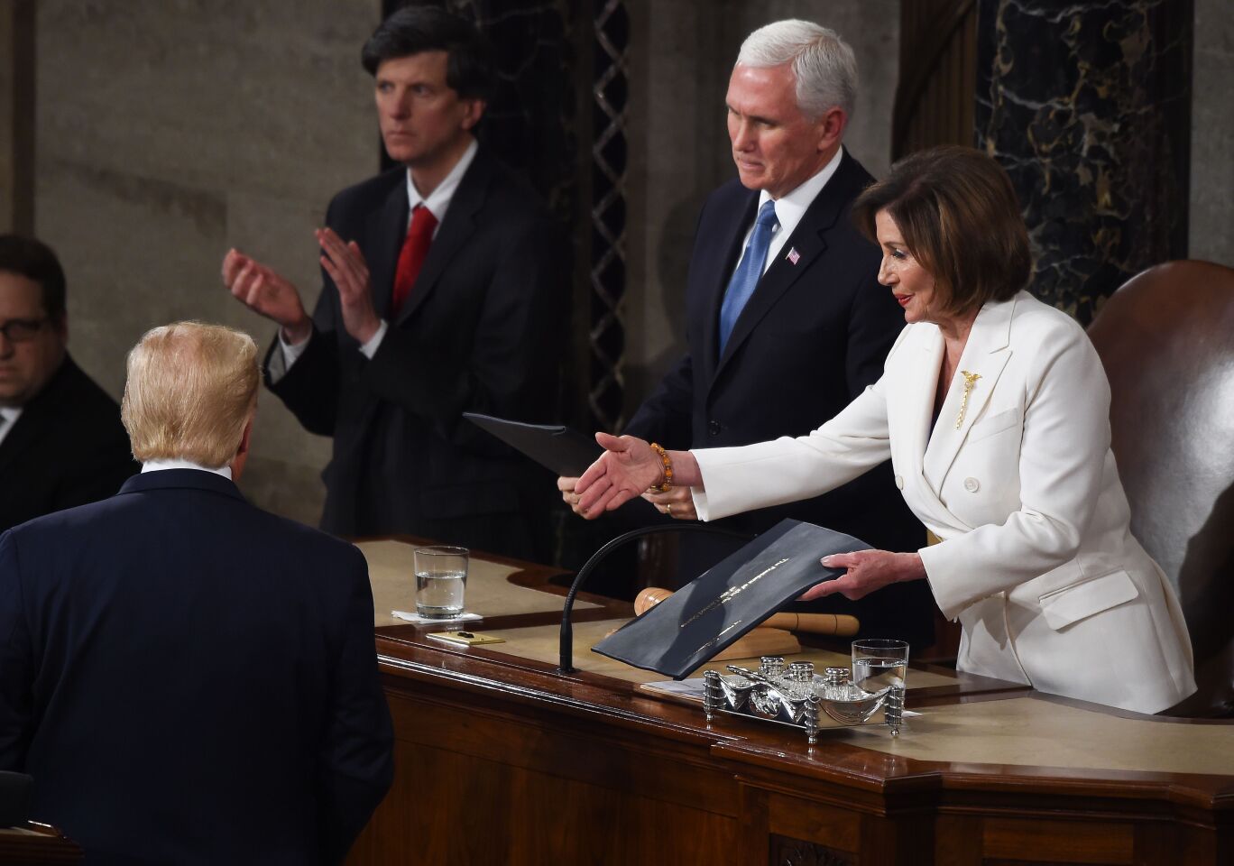 Speaker of the US House of Representatives Nancy Pelosi extends a hand to US president Donald Trump ahead of the State of the Union address at the US Capitol in Washington, DC, on February 4, 2020. (Photo by Olivier DOULIERY / AFP) (Photo by OLIVIER DOULIERY/AFP via Getty Images) ** OUTS - ELSENT, FPG, CM - OUTS * NM, PH, VA if sourced by CT, LA or MoD **