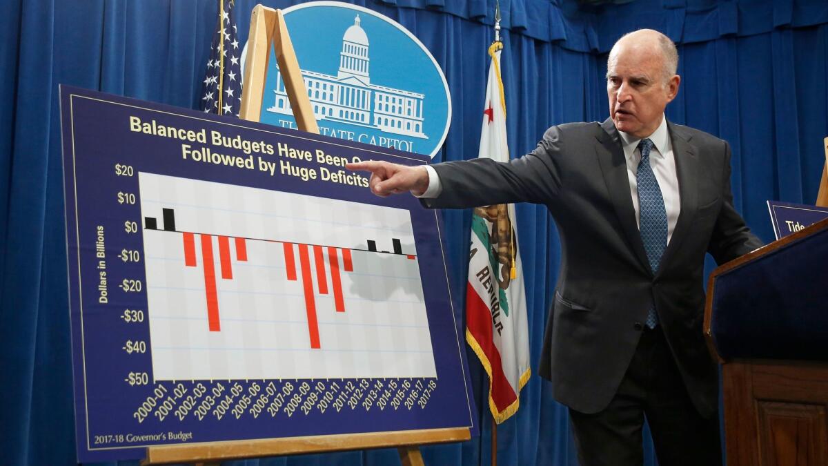 Gov. Jerry Brown discusses his 2017-2018 spending plan at a news conference in January. Brown will unveil his revised spending plan later this week.
