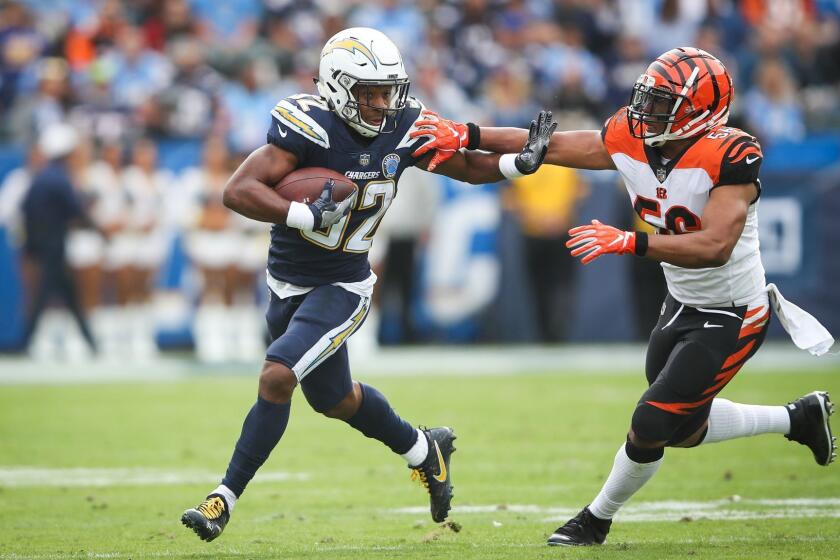 CARSON, CA - DECEMBER 09: Running back Justin Jackson #32 of the Los Angeles Chargers makes a play in front of middle linebacker Hardy Nickerson #56 of the Cincinnati Bengals for a first down in the first quarter at StubHub Center on December 9, 2018 in Carson, California. (Photo by Sean M. Haffey/Getty Images) ** OUTS - ELSENT, FPG, CM - OUTS * NM, PH, VA if sourced by CT, LA or MoD **
