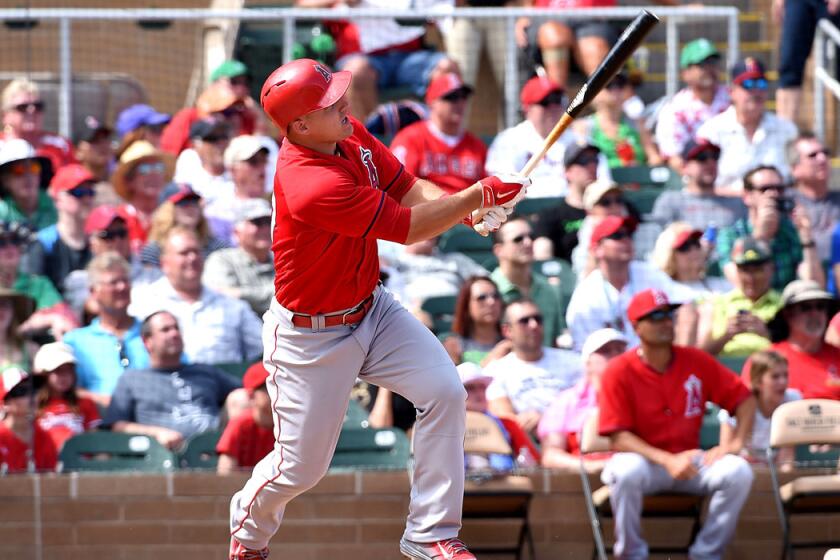Angels' Mike Trout extended his hitting streak to nine games during a, 15-8, loss to the Rangers on Tuesday.