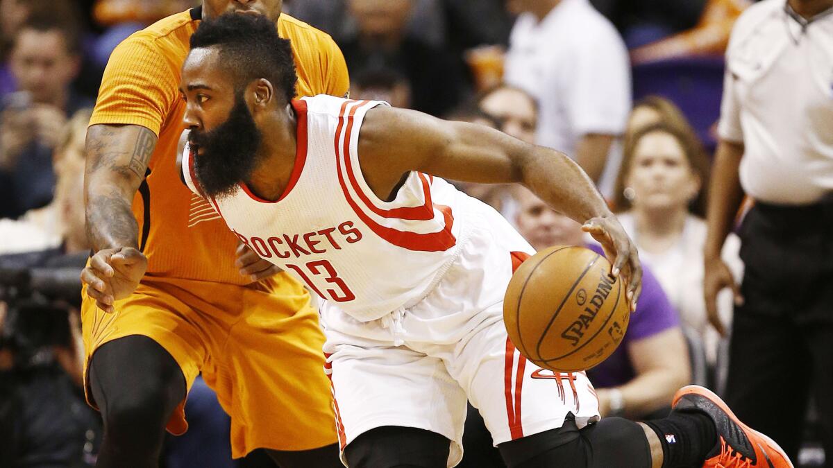 Houston Rockets guard James Harden drives past Phoenix Suns guard P.J. Tucker during a game on Jan. 23.