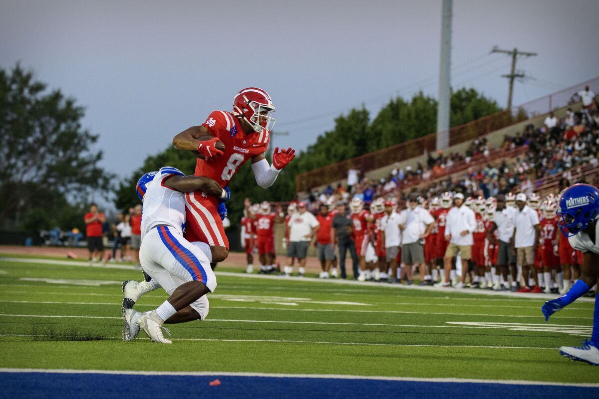 Mater Dei wide receiver C.J. Williams catches a pass for a first down against the Duncanville Panthers in August 2021.