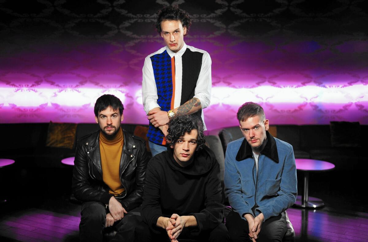 The 1975 are, clockwise from center-front, Matthew Healy, Ross MacDonald, George Daniel and Adam Hann.