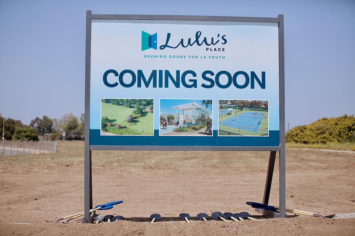 A sign on a vacant 31-acre lot announces the development of Lulu's Place.