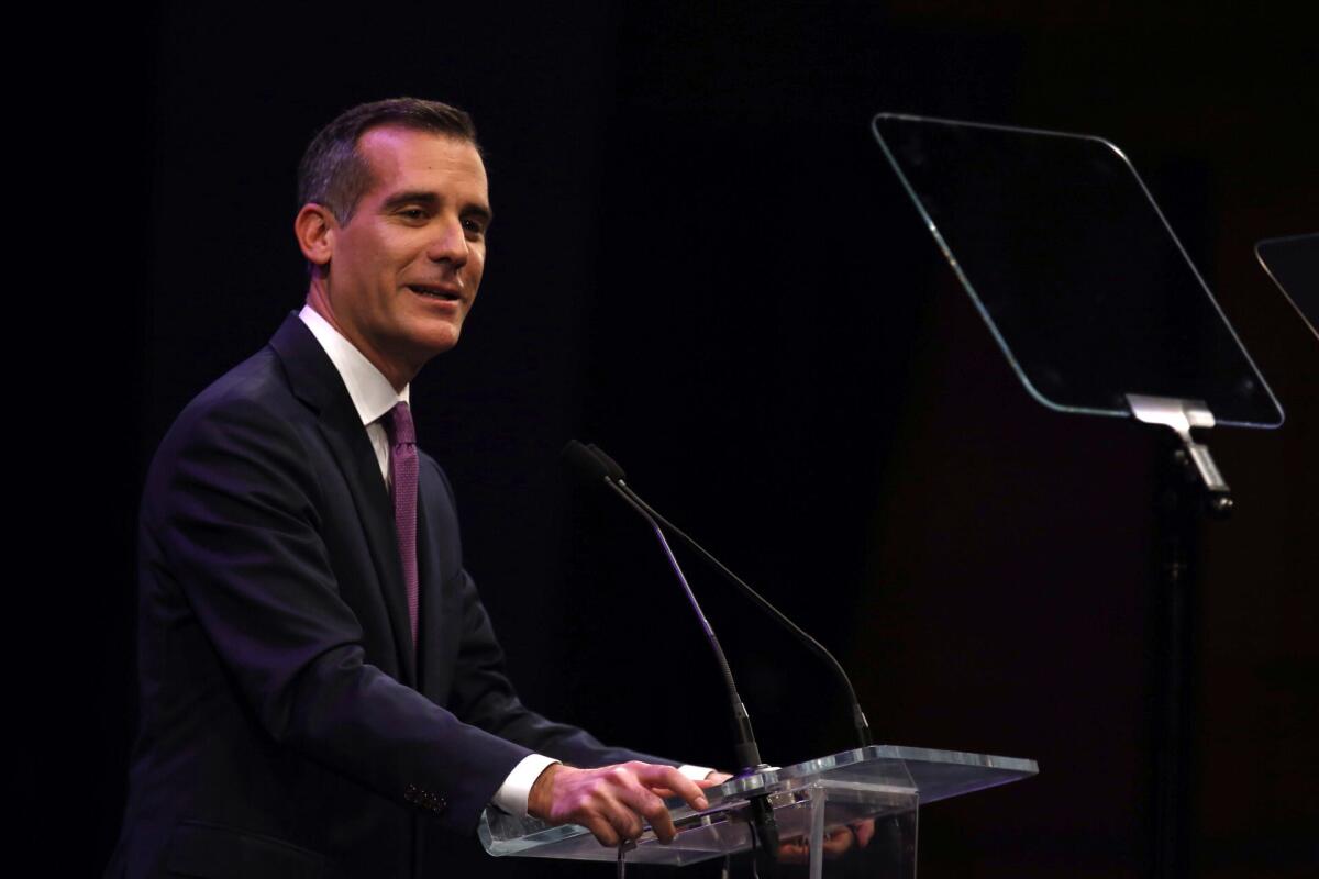 Los Angeles Mayor Eric Garcetti delivers his State of the City address at Cal State Northridge on Tuesday. He announced five new or expanded crime prevention and suppression initiatives during his speech.