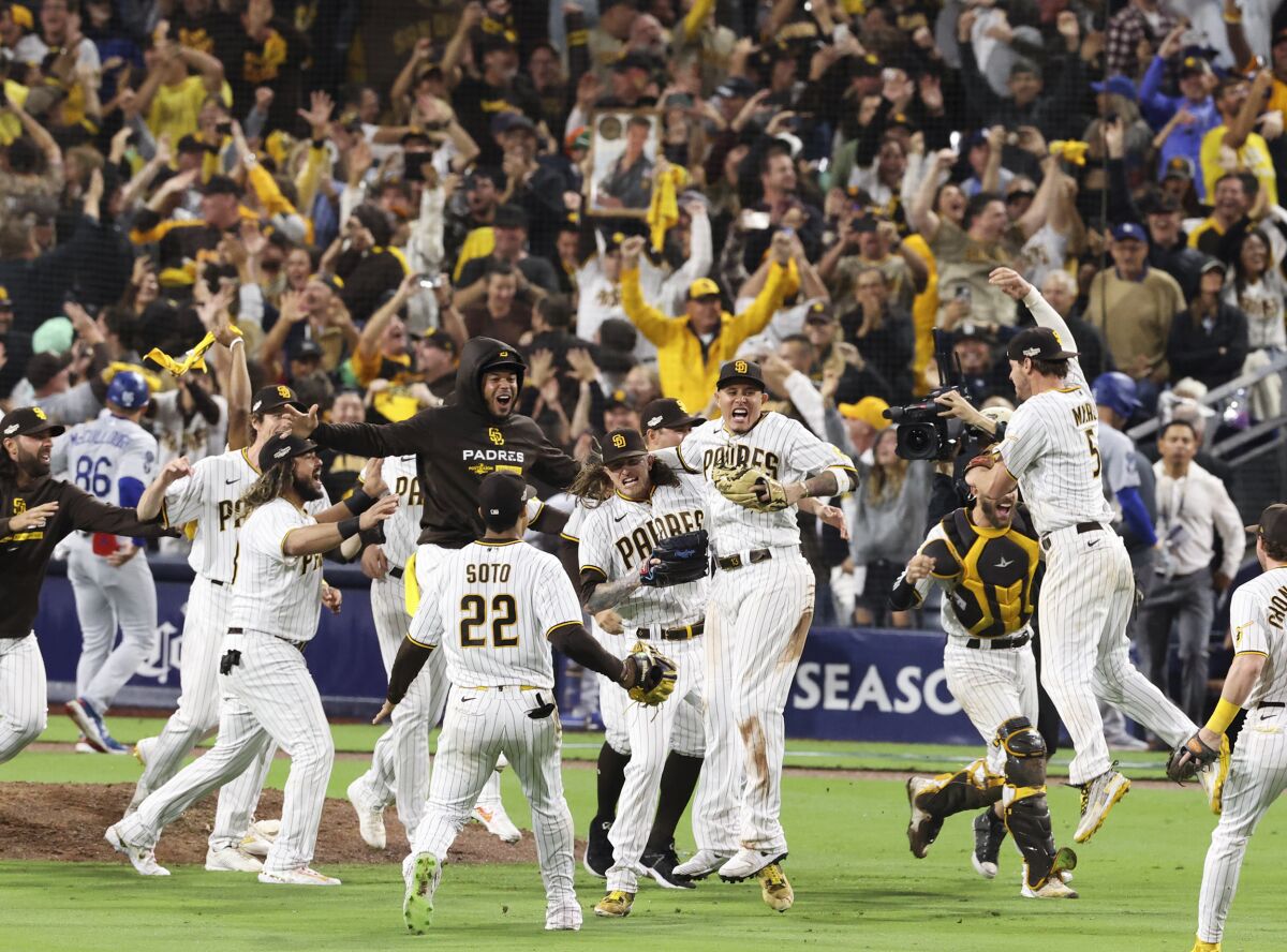 The San Diego Padres celebrate a 5-3 win over the Dodgers in Game 4 of the NLDS on October 15, 2022.