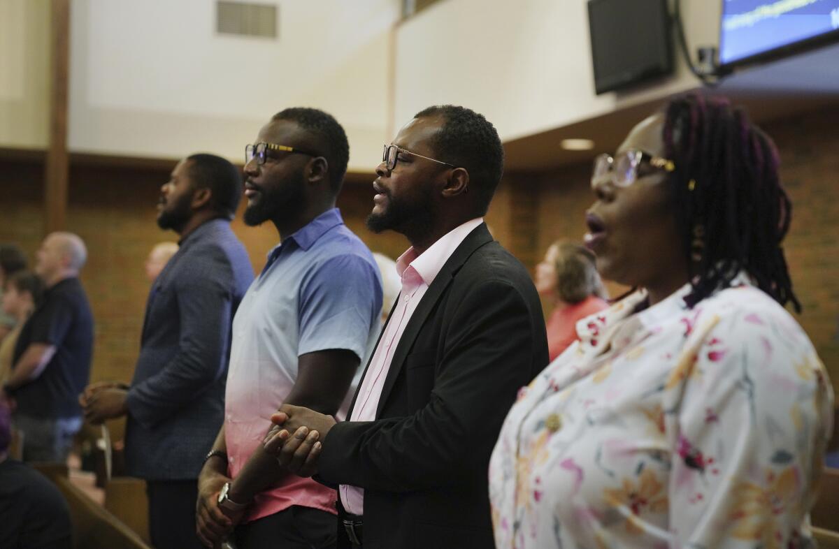 Members of the Haitian community in Springfield, Ohio, stand for worship at Central Christian Church.