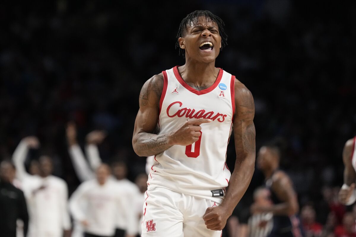 Houston guard Marcus Sasser (0) reacts as his team defeats Auburn in a second-round college basketball game in the NCAA Tournament in Birmingham, Ala., Saturday, March 18, 2023. (AP Photo/Rogelio V. Solis)