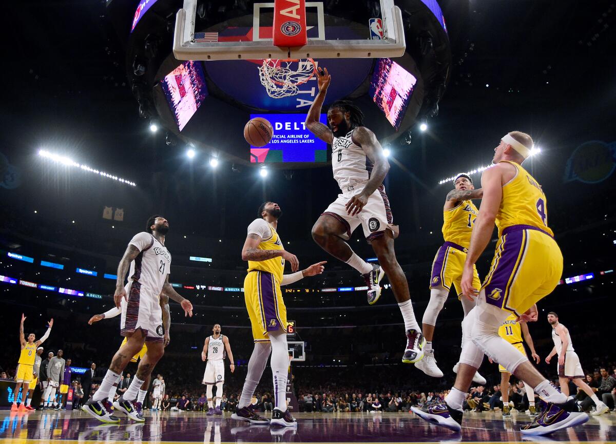 LOS ANGELES, CALIFORNIA - MARCH 10: DeAndre Jordan #6 of the Brooklyn Nets dunks in front of Anthony Davis #3, Danny Green #14 and Alex Caruso #4 of the Los Angeles Lakers during a 104-102 Nets win at Staples Center on March 10, 2020 in Los Angeles, California. (Photo by Harry How/Getty Images) NOTE TO USER: User expressly acknowledges and agrees that, by downloading and or using this photograph, User is consenting to the terms and conditions of the Getty Images License Agreement.