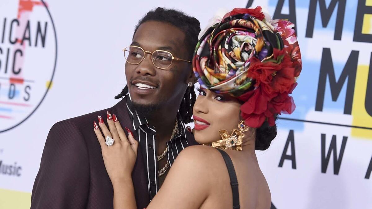 Offset, left, and Cardi B arrive at the American Music Awards in October.