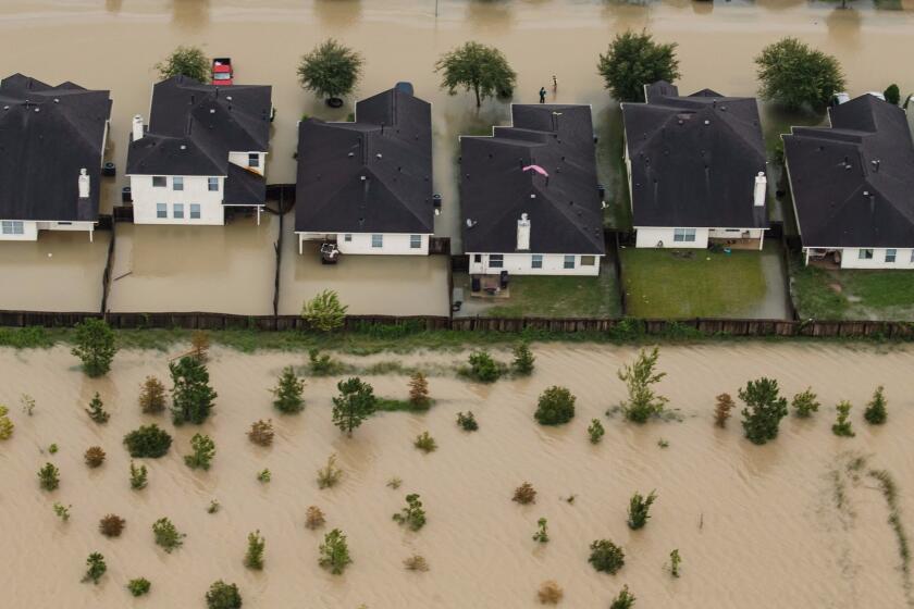 HOUSTON, TEXAS -- TUESDAY, AUGUST 29, 2017: Residential neighborhoods near the Interstate 10 sit in floodwater in the wake of Hurricane Harvey in Houston, Texas, on Aug. 29, 2017. (Marcus Yam / Los Angeles Times)
