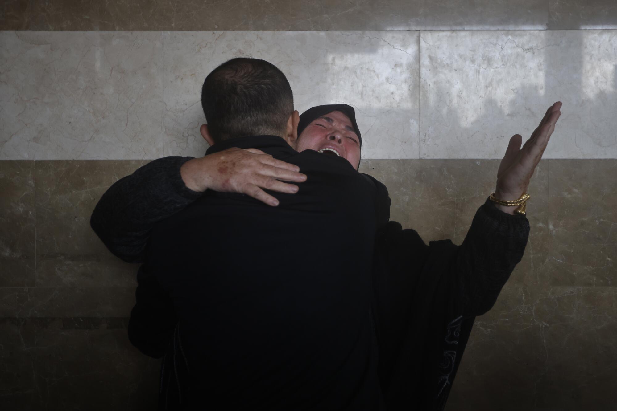 Woman weeping for relatives killed in Israel's bombardment of Gaza