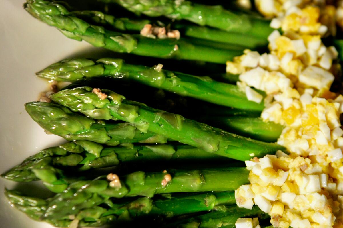 122212.FO.0328.food15.GEM Easter sides -- asparagus spears with chopped egg and anchovy.