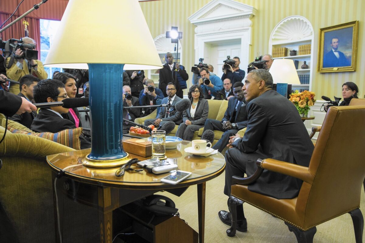 President Obama meets with a group of so-called Dreamers at the White House. Under Obama's Deferred Action for Childhood Arrivals program, young people in the country illegally can qualify for a reprieve from deportation if they meet certain criteria.
