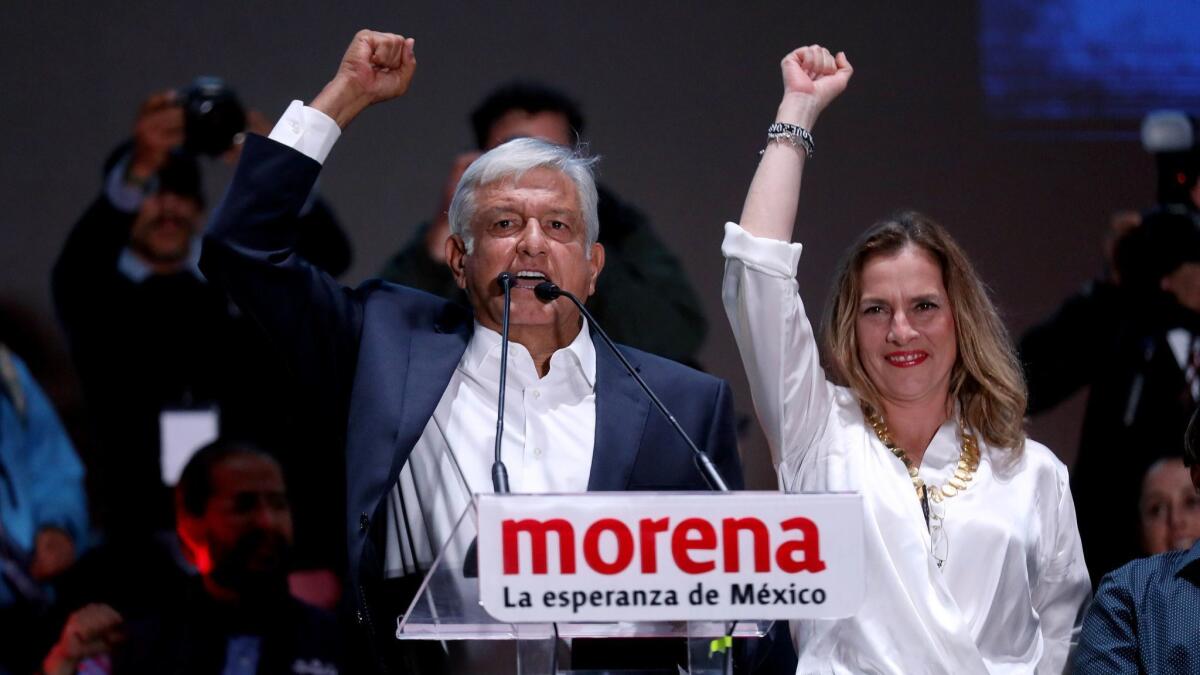 Newly elected president of Mexico Andres Manual Lopez Obrador, shown with his wife, Beatriz Gutierrez Mueller, makes an appearance in the Zocalo square on election day in Mexico City.