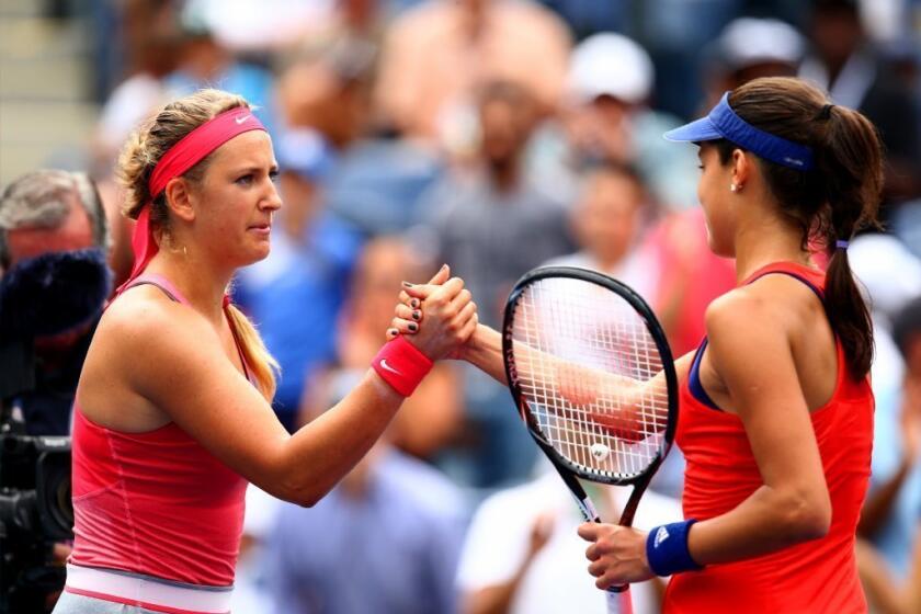 Victoria Azarenka, left, and Ana Ivanovic meet at the net after their match.