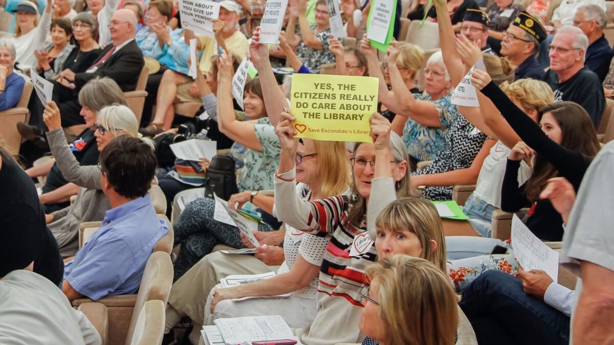 Hundreds of people jammed the Escondido City Council Chambers Wednesday night, almost all to protest plans to outsource the city's library services to a private company. The council voted 3 to 2 to move ahead with the plans.