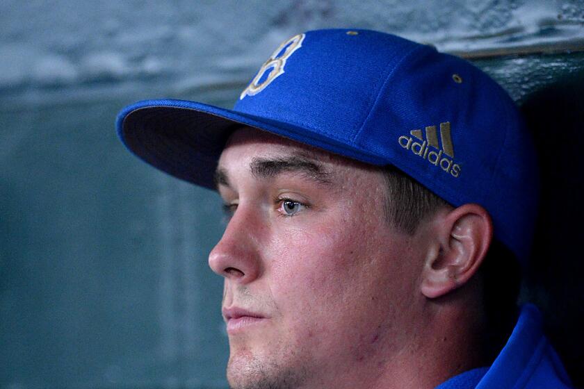 David Berg sits in the UCLA dugout during a 2015 game against Maryland 