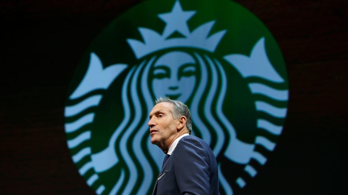 Howard Schultz, shown March 23, is stepping down as Starbucks' CEO and become the company's executive chairman.