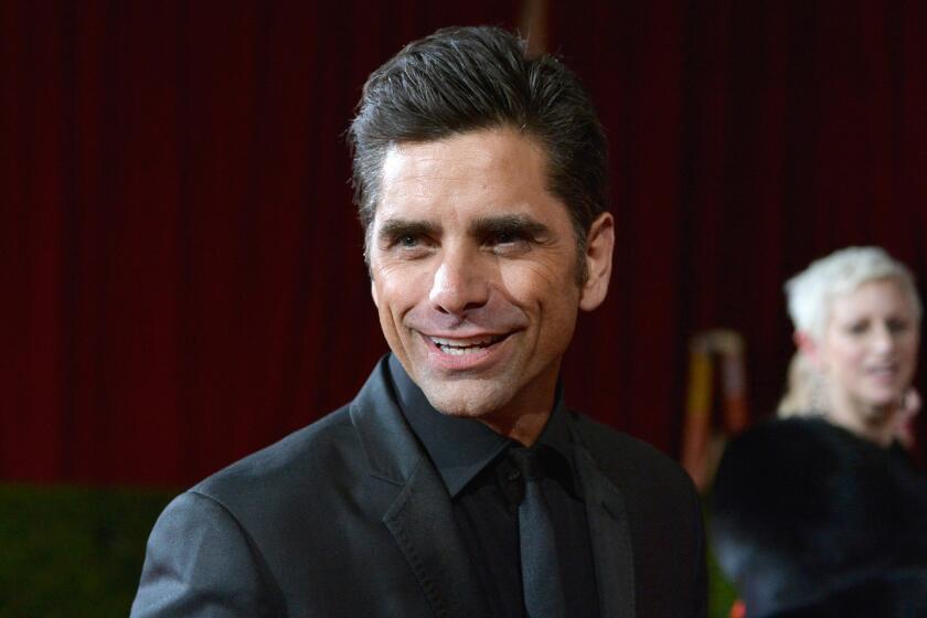 John Stamos tweets his return after a reported stint in rehab for substance-abuse treatment.