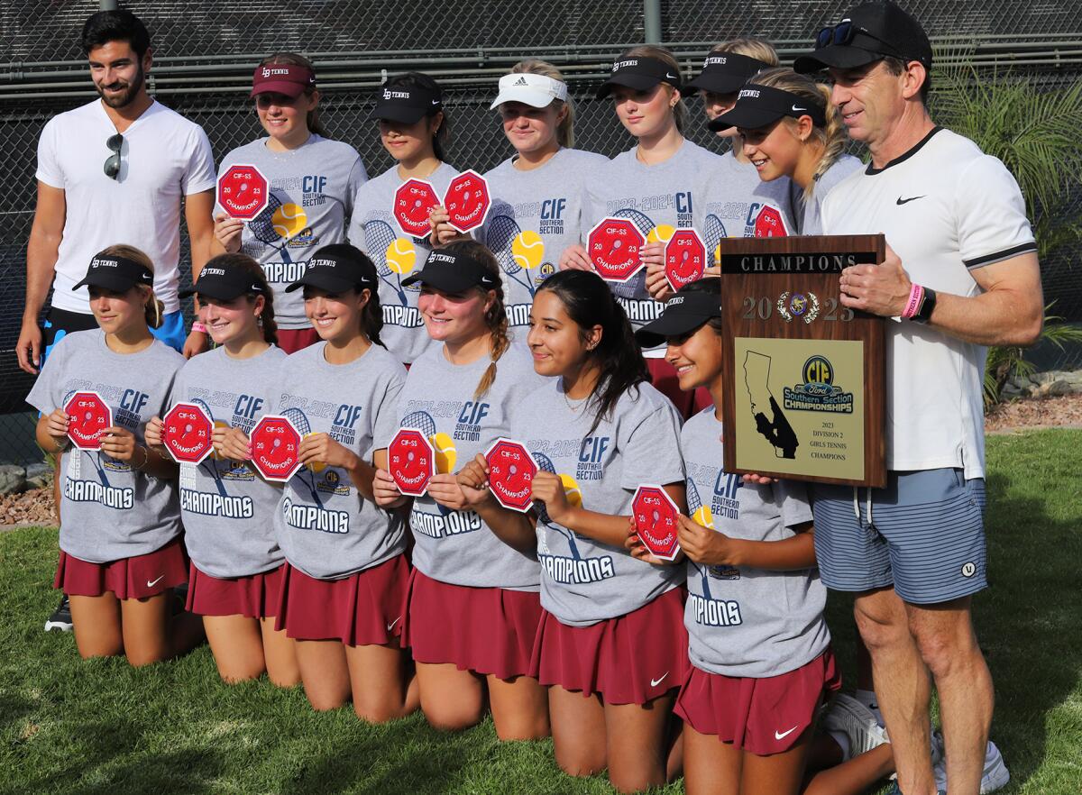 The Laguna Beach High School girls' tennis team poses for a picture after winning the CIF Southern Section Division 2 title.