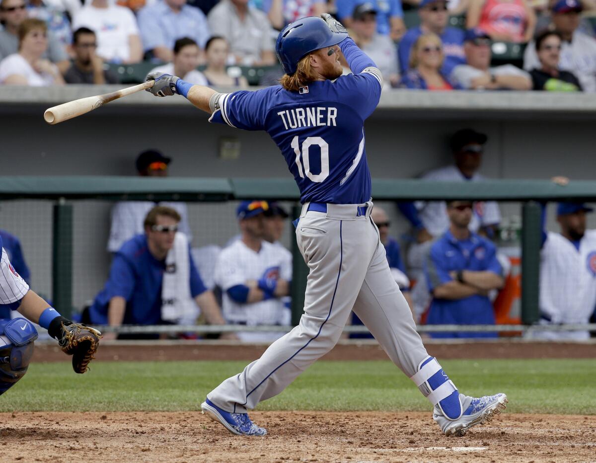 Dodgers infielder Justin Turner, batting earlier in spring training, was hit by pitches twice by the Diamondbacks.