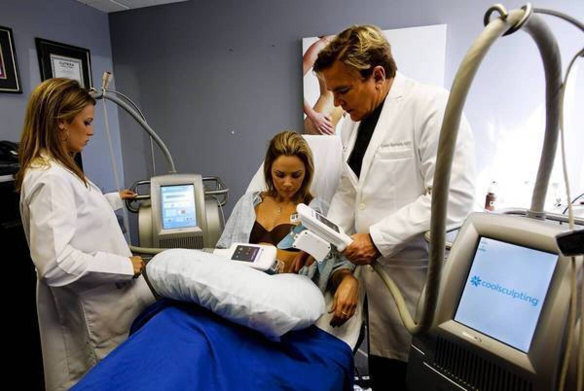 Dr. Grant Stevens and Laura Pietrzak demonstrate how Coolsculpting works on a client at The Institute at Marina Plastic Surgery in Marina del Rey.