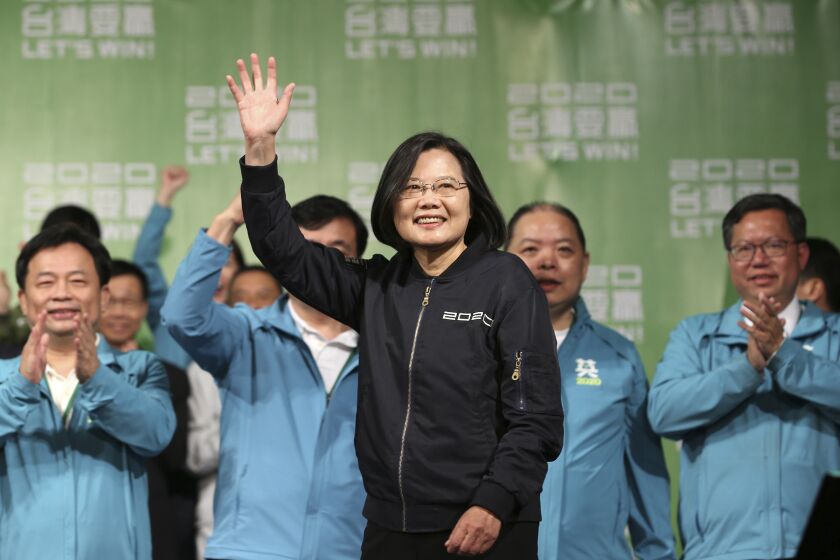 Taiwan's 2020 presidential election candidate, Taiwanese President Tsai Ing-wen celebrates her victory with supporters in Taipei, Taiwan, Saturday, Jan. 11, 2020. Taiwan's independence-leaning President Tsai Ing-wen won a second term in a landslide election victory Saturday, signaling strong support for her tough stance against China. (AP Photo/Chiang Ying-ying)