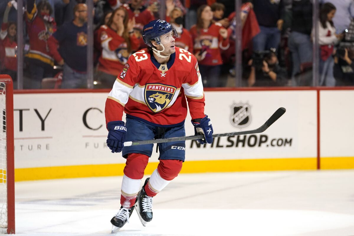 Florida Panthers center Carter Verhaeghe (23) looks at the scoreboard after scoring a goal during the second period of Game 5 of the first round of the NHL Stanley Cup hockey playoffs against the Washington Capitals, Wednesday, May 11, 2022, in Sunrise, Fla. (AP Photo/Lynne Sladky)