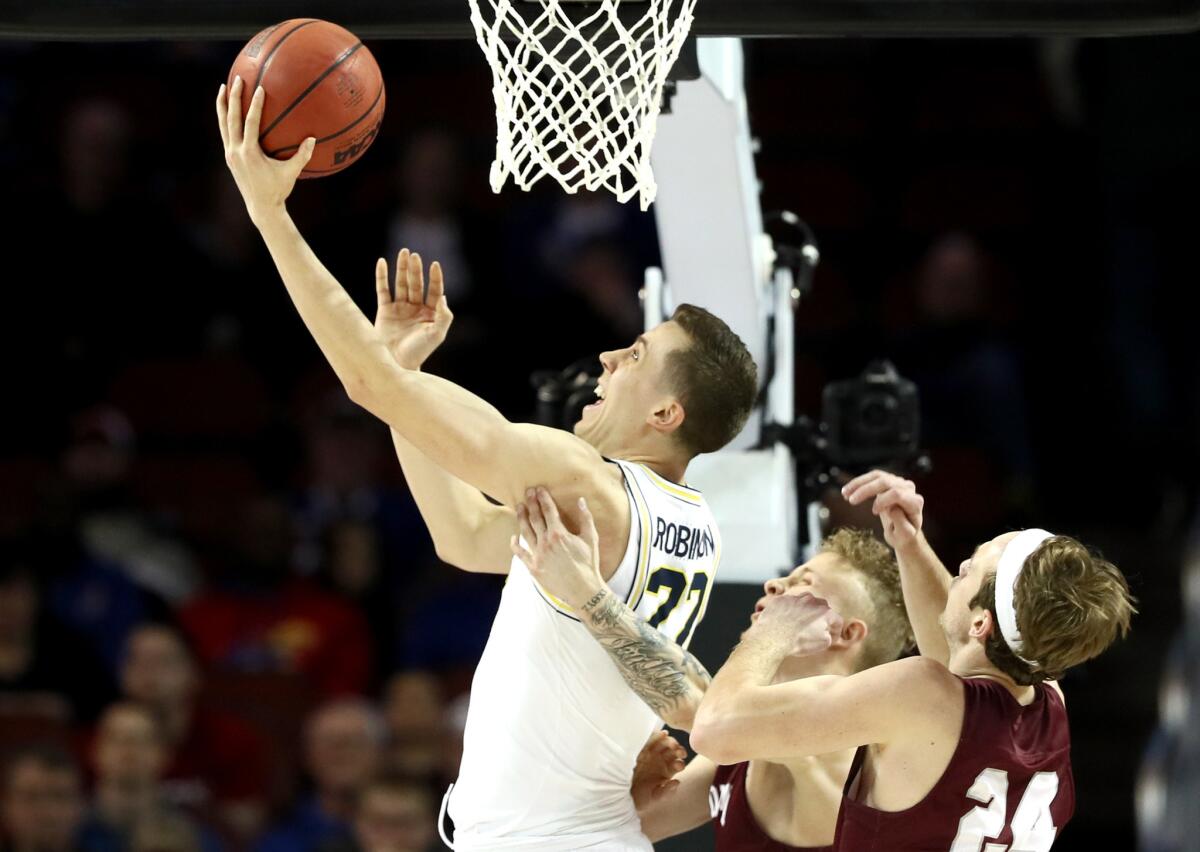 Michigan's Duncan Robinson attempts a lay-up against Montana during the first round of the NCAA tournament in Wichita, Kan., on March 15.