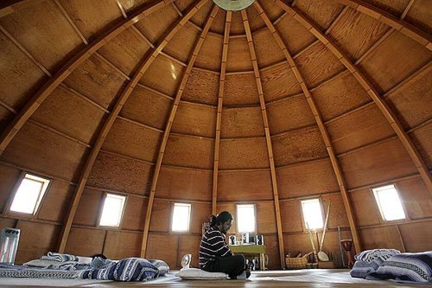 Carlos Coyan of Rancho Cucamonga meditates as more than a dozen people gather at the Integratron in Landers for a "sound bath." "I would describe it as the fusion of art, science and magic," said co-owner Joanne Karl. Video