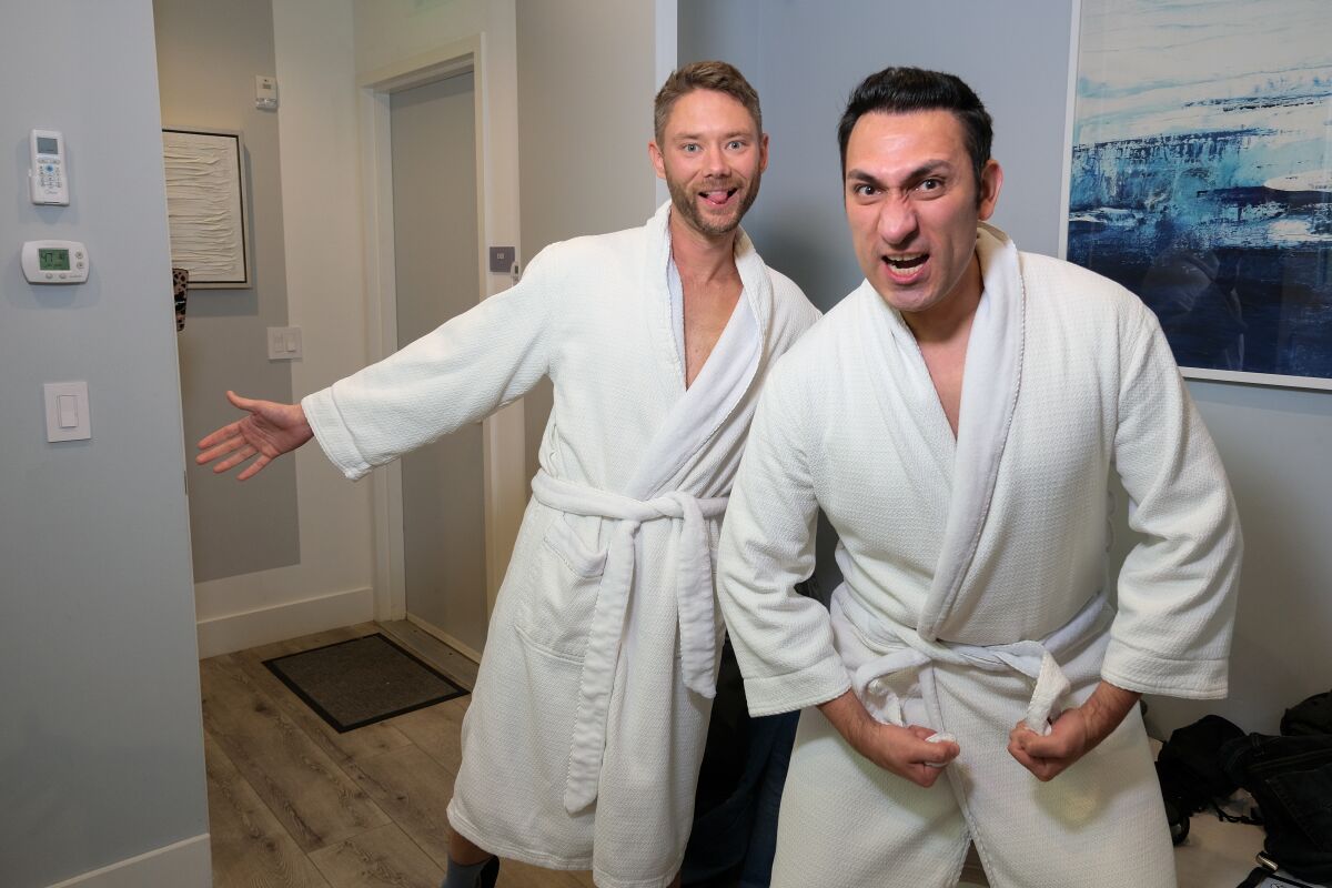 (From left to right) Before entering a cryotherapy chamber at Livkraft in La Jolla, Josh and Mateo pose for a photo.