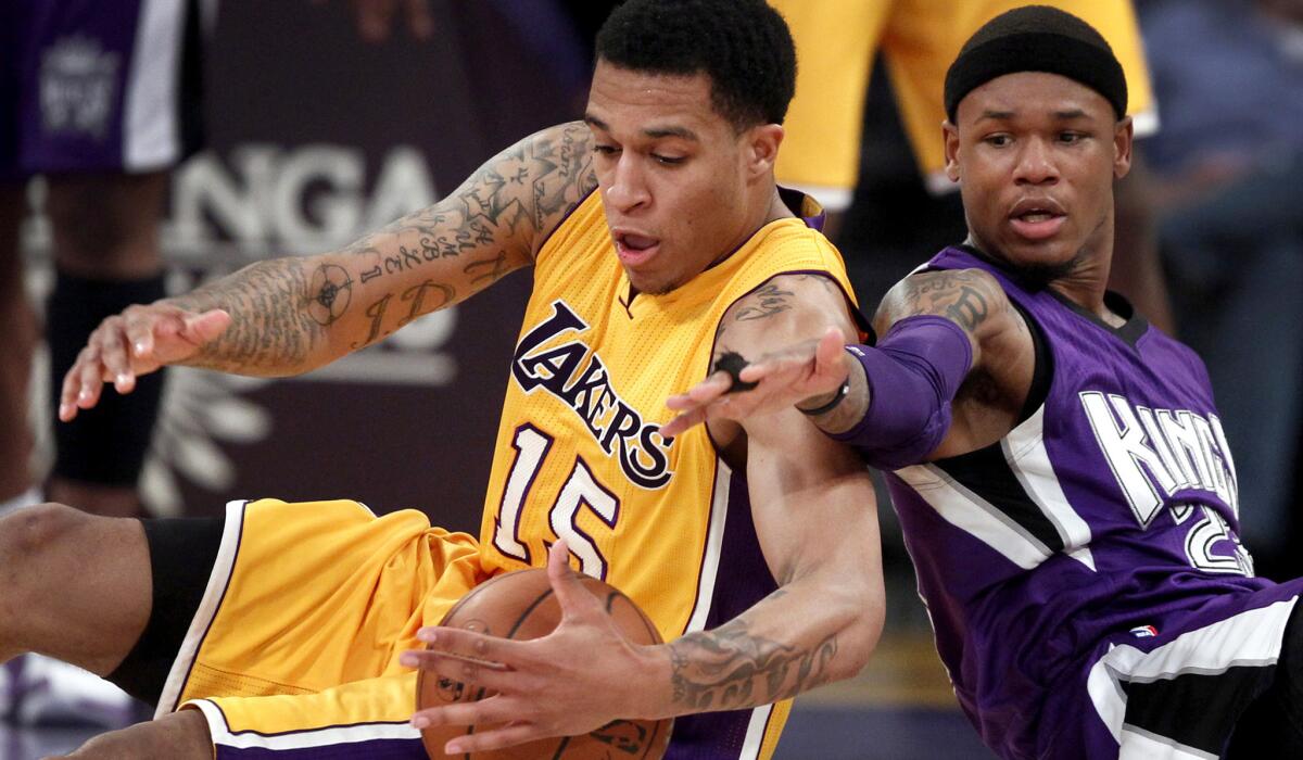 Lakers guard Jabari Brown battles Kings guard Ben McLemore for a loose ball during the fourth period at Staples Center.