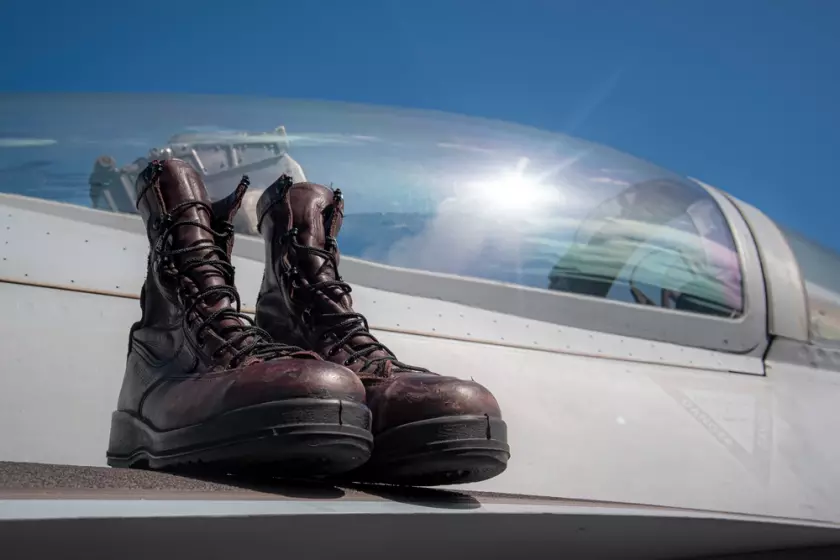 The boots of the late retired Rear Adm. Donald Bullard rest on a F/A-18E Super Hornet.