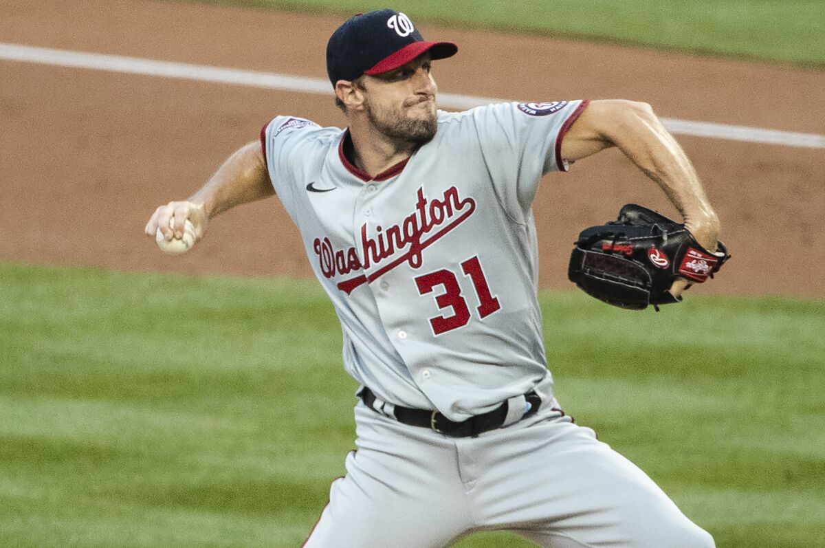Washington Nationals' Max Scherzer (31) delivers a pitch during the first inning of a baseball game against the New York Mets Tuesday, Aug. 11, 2020, in New York. (AP Photo/Frank Franklin II)