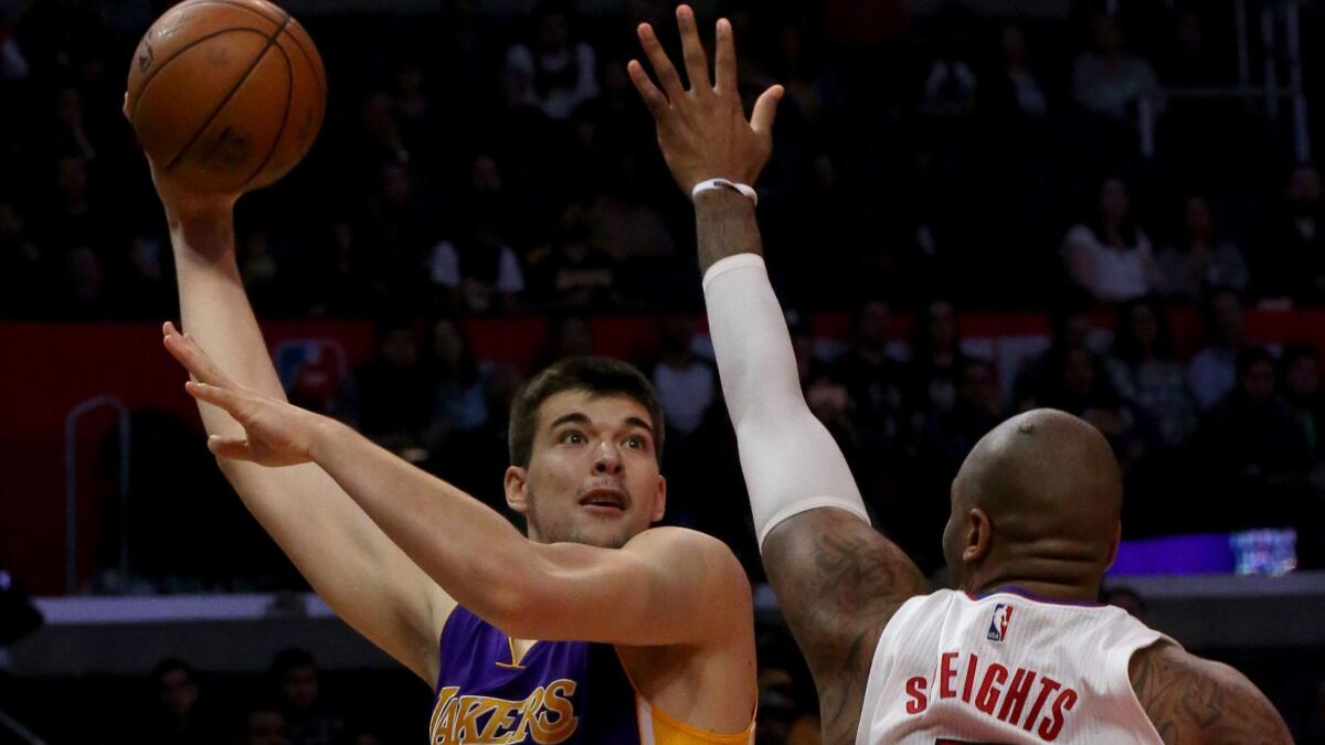 Lakers rookie center Ivica Zubac attempts a hook shot against Clippers forward Marreese Speights during the fourth quarter of their game Saturday.