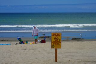 Coronado, CA - May 26: On Friday, May 26, 2023 in Coronado, Brendan Nolan from Phoenix, Arizona was disappointment when he was alerted by the lposted signs from the County of San Diego Environmental Health & Quality, warning beach goers of sewage/chemical contaminated water. And the recommendation to keep out of the water. (Nelvin C. Cepeda / The San Diego Union-Tribune)
