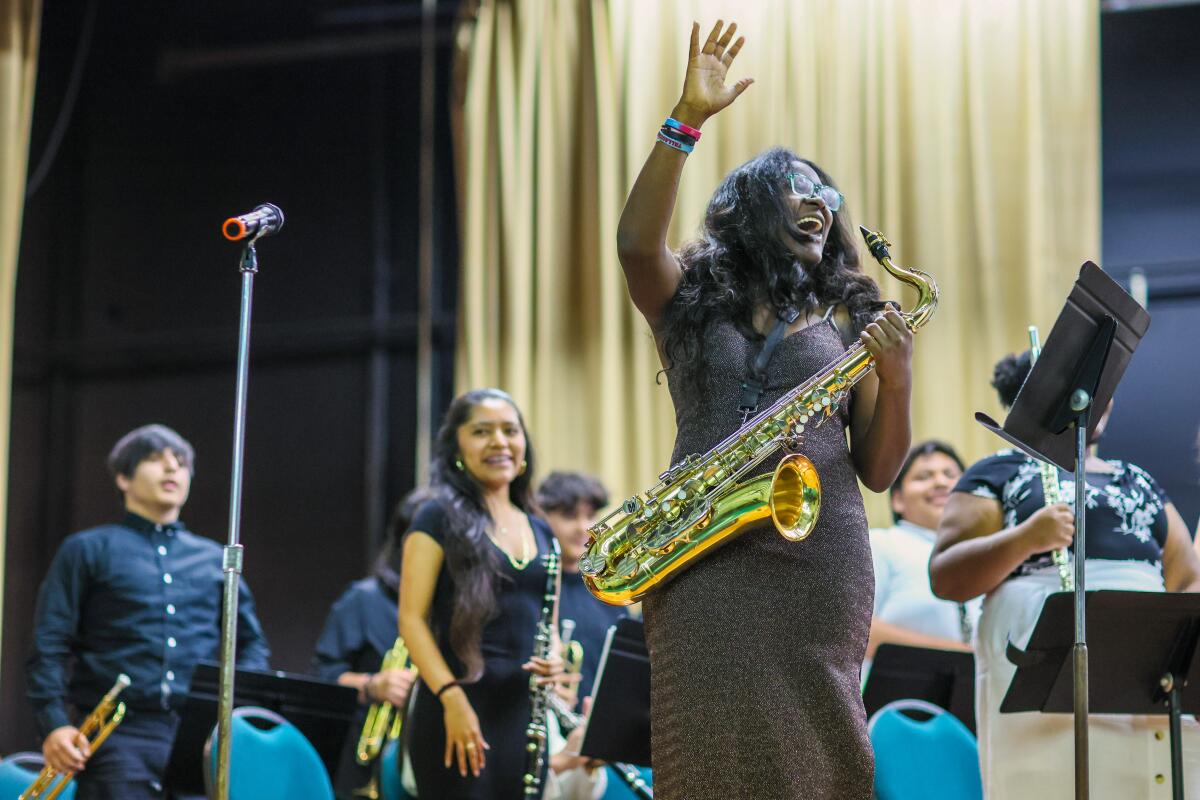 Inglewood High School senior Itevia 'Ivy' Jack performs a sax solo at concert.