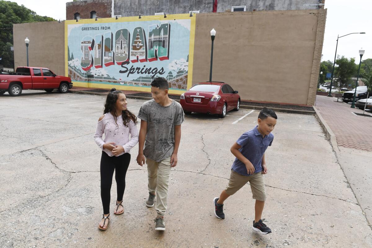Dyanara Solis, 11, from left, and her brothers Dominic, 12, and Dorian 8, in Siloam Springs, Ark. The children are living with relatives after their mother, Mayra Machado, was deported to El Salvador last year.