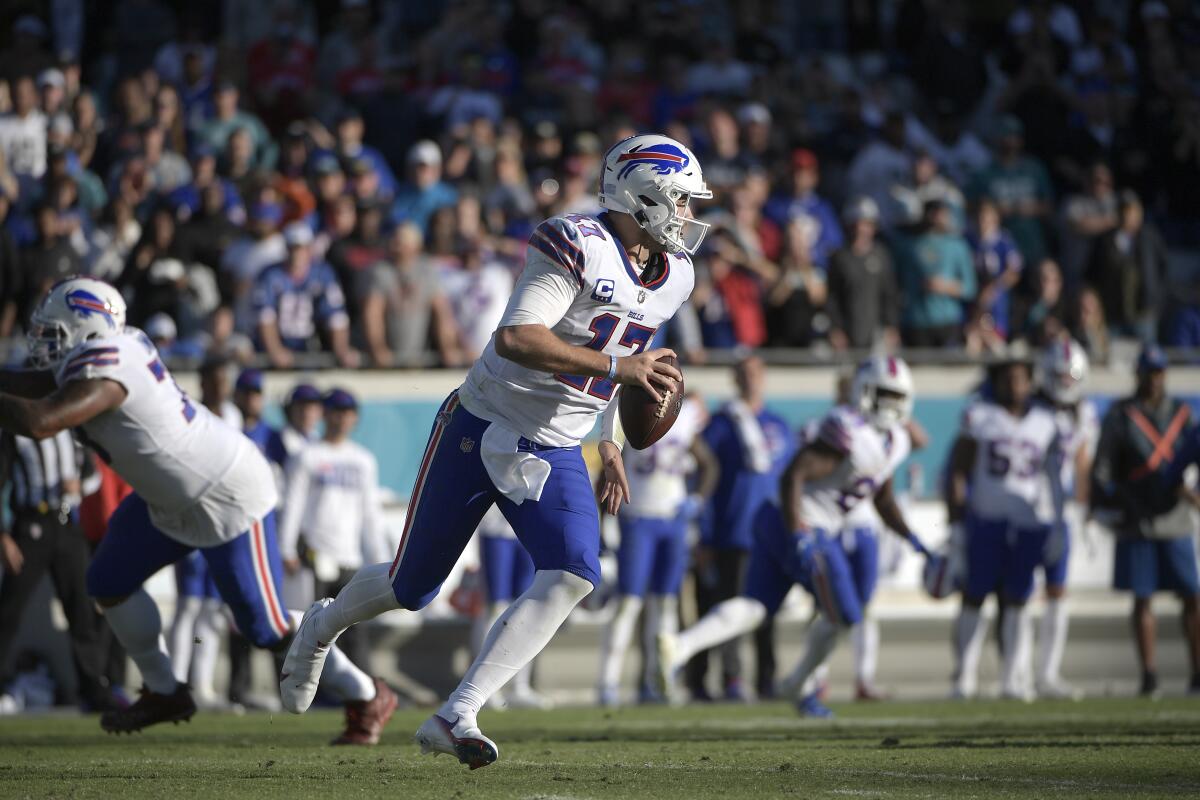 Buffalo Bills quarterback Josh Allen looks for a receiver.