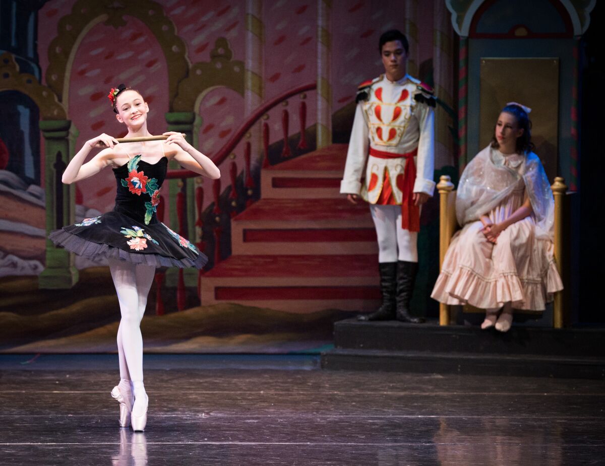 Misha MacGowan, left, dancing as a Mirliton in the Southern California Ballet’s 2021 production of “The Nutcracker.”