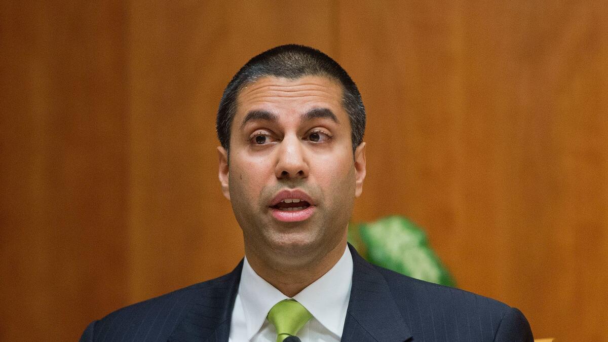 Federal Communication Commission Commissioner Ajit Pai speaks during an open hearing and vote on "Net Neutrality" in Washington on Feb. 26, 2015.