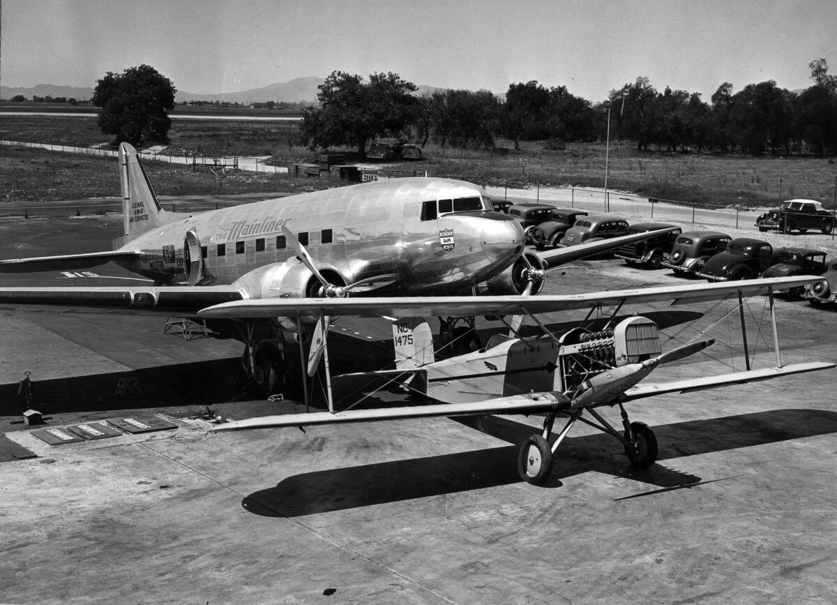 April 16, 1940: A Douglas M-2, first plane used by Western Air Express, and a Douglas DC-3, at Union Air Terminal for the airlines 14th anniversary celebration.