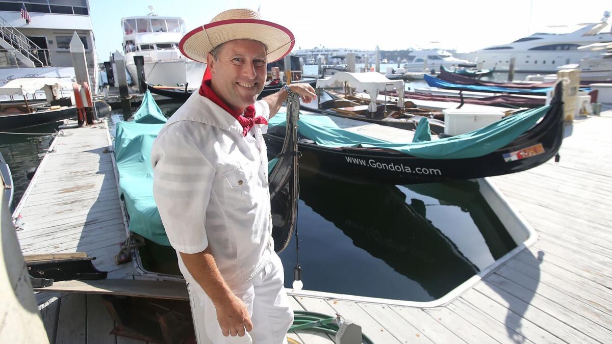 Greg Mohr with two of his gondolas. “We create perfect moments that become great memories,” he says of the trips he conducts around Newport Harbor.