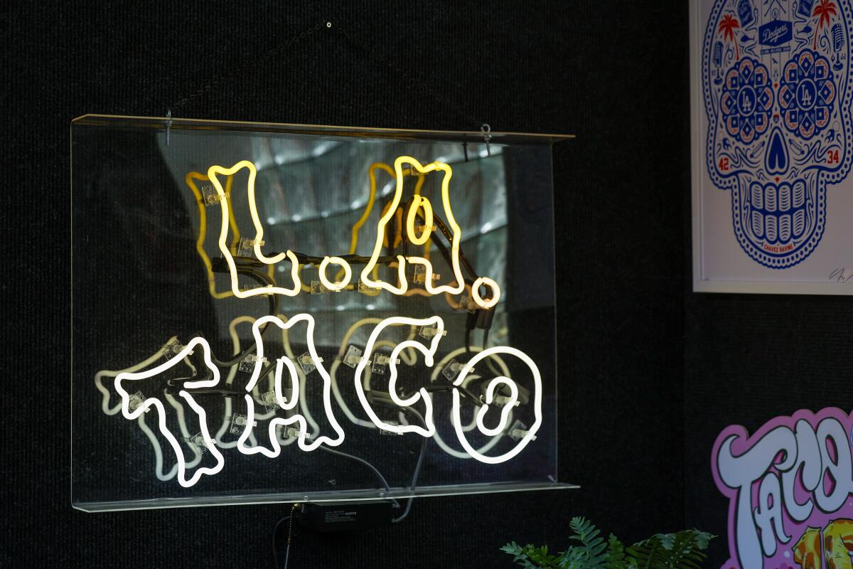 A neon L.A. Taco sign.