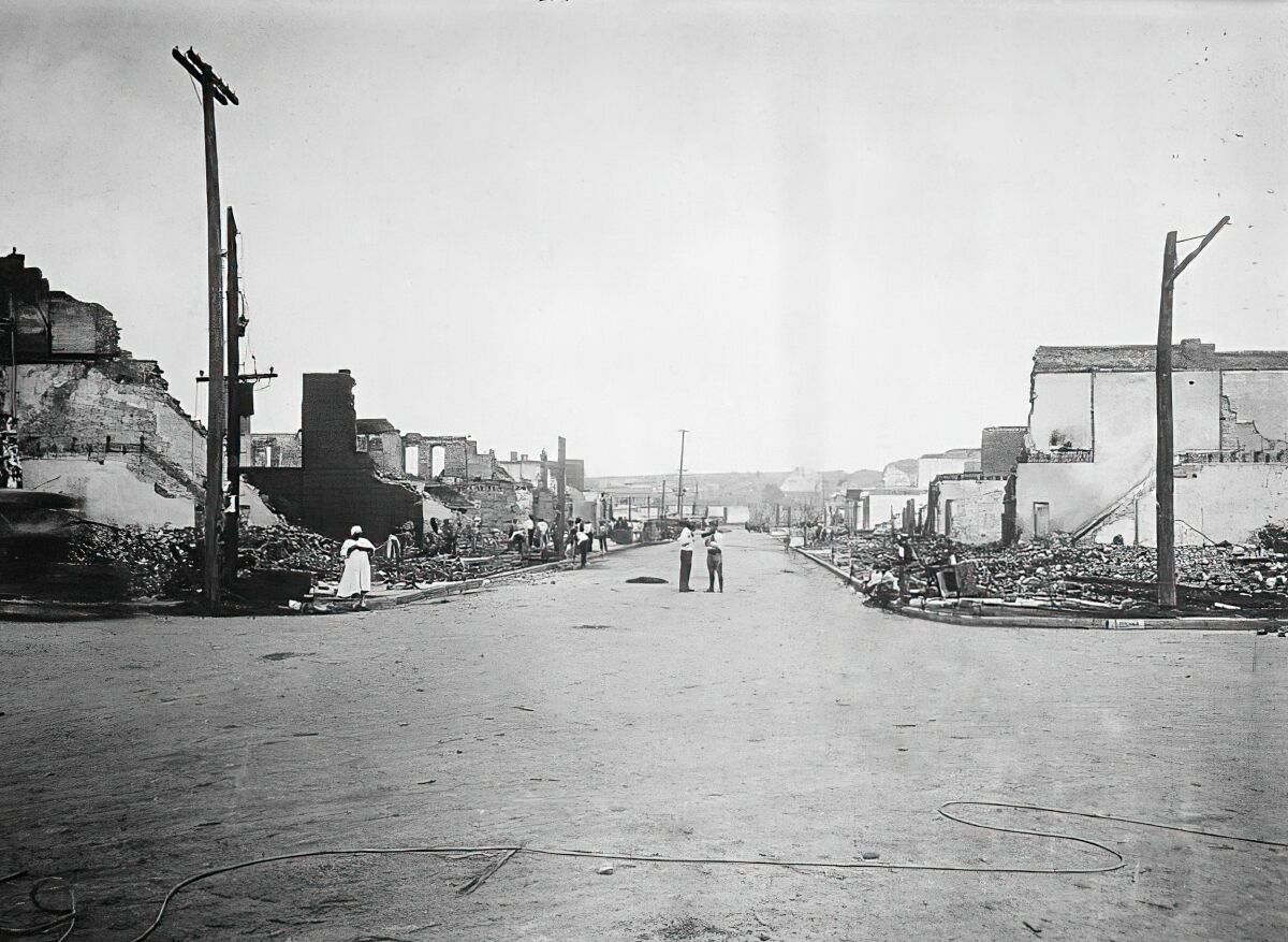 A street in Tulsa, Okla., with buildings on both sides reduced to rubble.